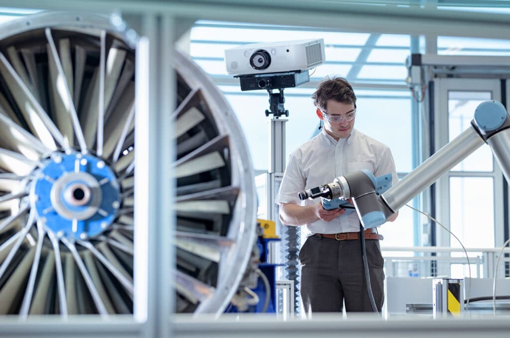 An engineer working on a jet engine.